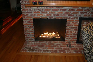 fire burner in a brick fireplace