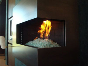 corner fireplace with burning glass