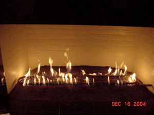 fireplace with lava rock and burner