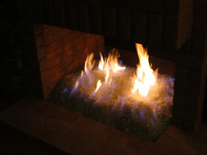 propane fire in a fireglass fireplpace